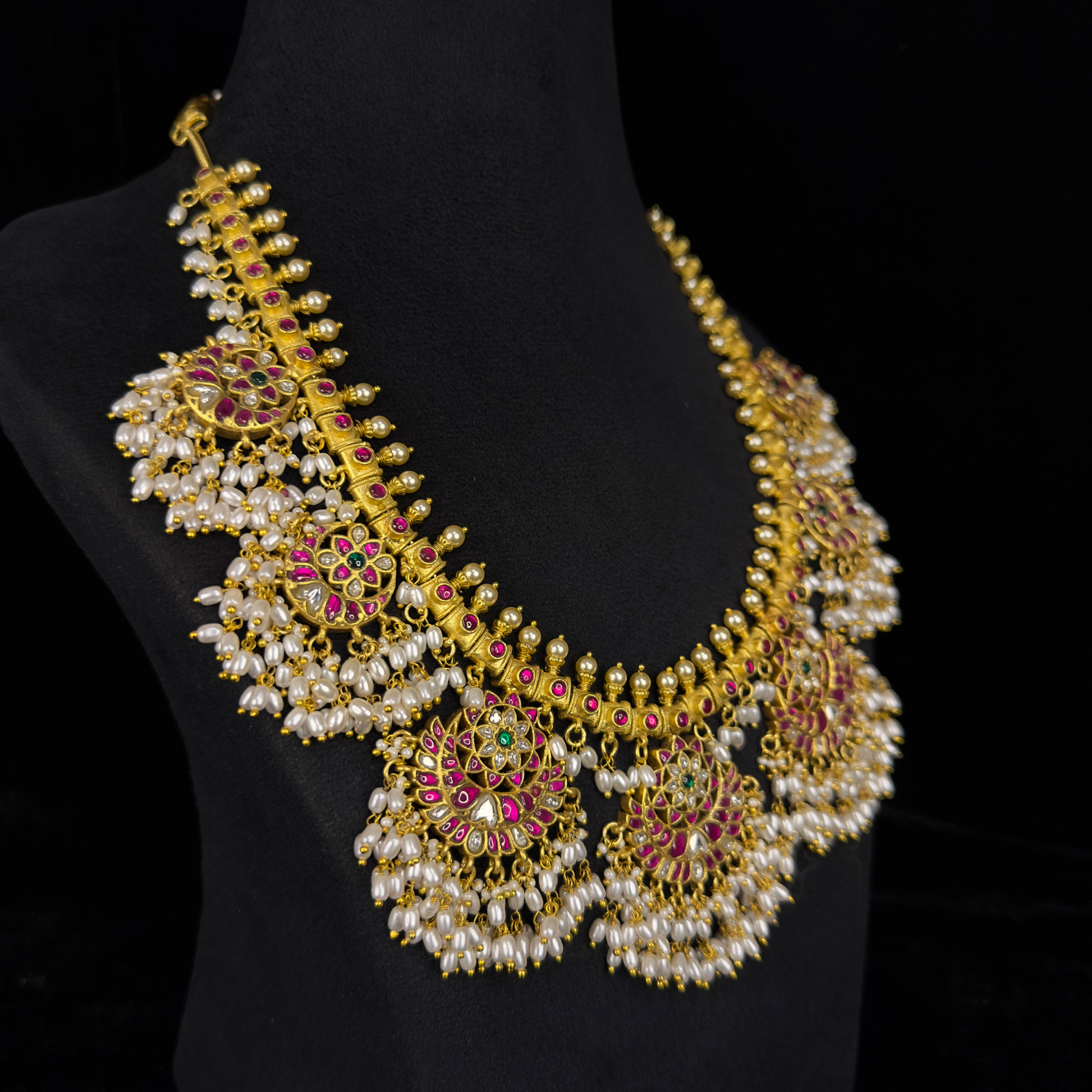 Opulent Guttapusulu Jadau Kundan Necklace with Pearl Tassels and Floral Accents with 22k gold platingThis product belongs to Jadau Kundan jewellery Category