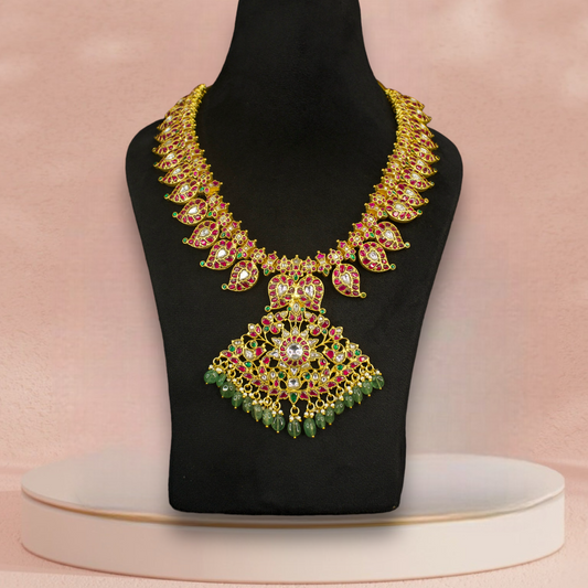 Exquisite Mango Motif Jadau Kundan Necklace in multi colour