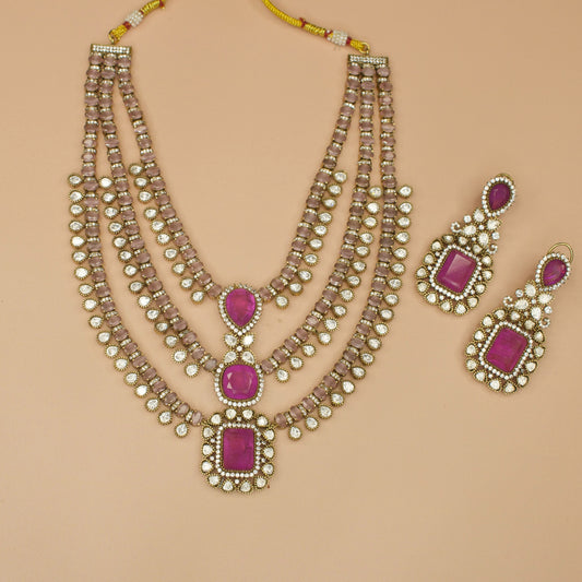 Gorgeous Three-Step Victorian Moissanite Necklace Set with zircon, polki, and emerald stones, including matching earrings. This Victorian Jewellery is available in Pink, Green & Purple colour variants. 