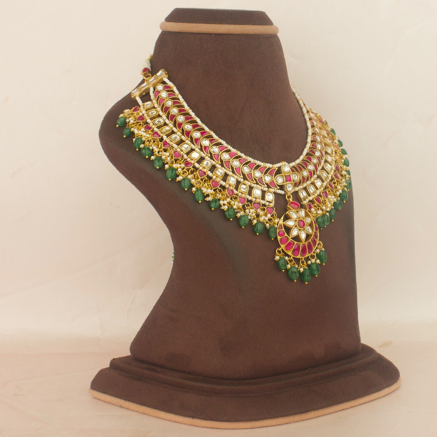 Bridal layered jadau kundan necklace with red and white stones and green beads