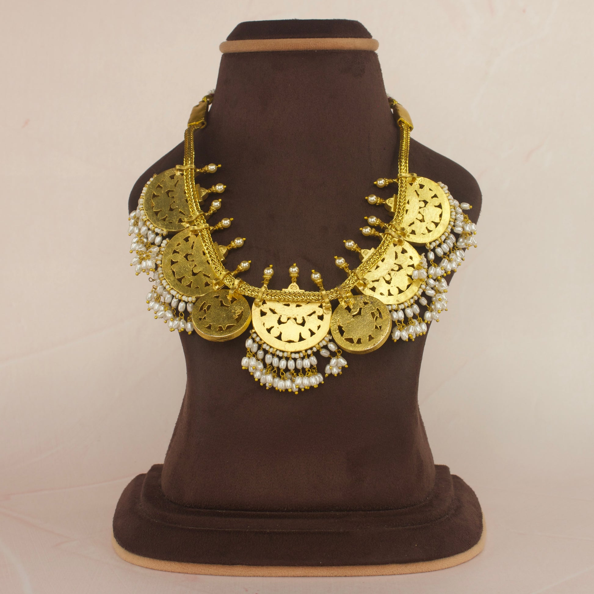 Opulent Jadau Kundan Necklace Adorned with Gleaming Rice Pearls with 22k gold plating This product belongs to Jadau Kundan jewellery category 