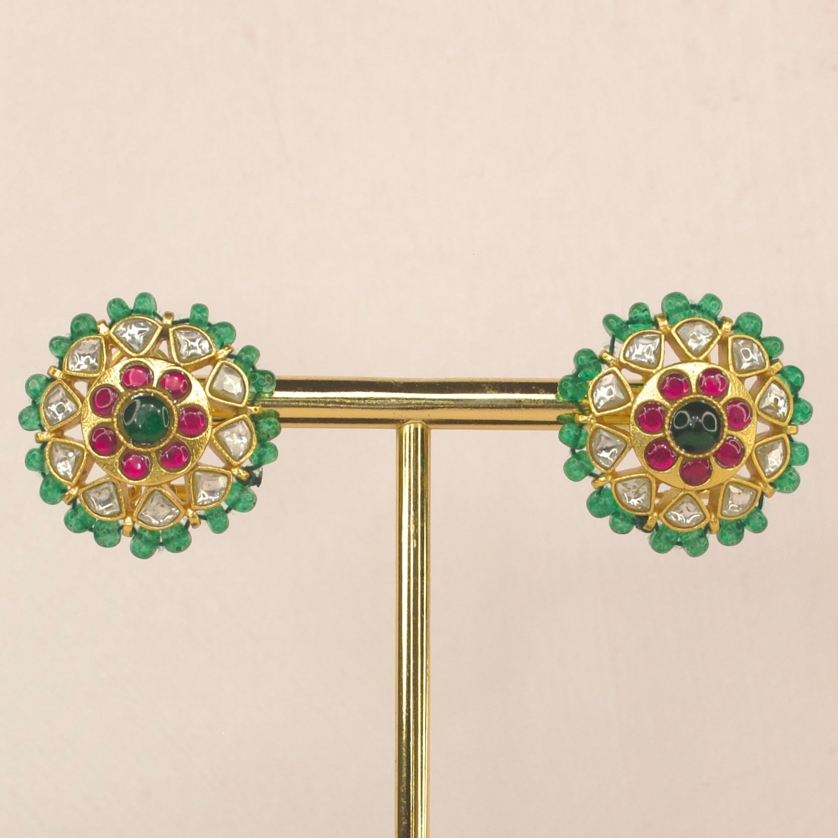 Floral jadau kundan studs earrings with emerald beads bordering