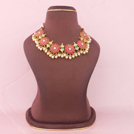 Premium Elegant Floral Jadau Kundan Necklace With Pearl Drops adorned with ruby stones, emerald
